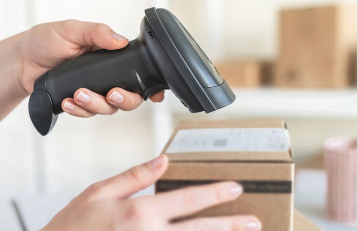 Handheld scanner used to scan a box's barcode
