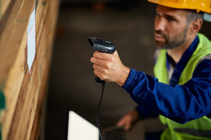 Warehouse staff using a USB connected barcode scanner to update inventory 